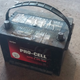 A typical 12 volt car battery.